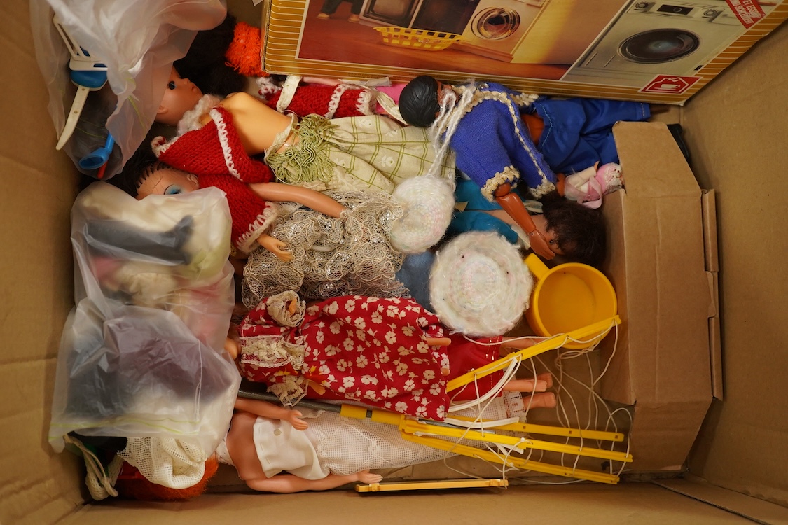 A collection of boxed Sindy doll furniture and accessories, including; a motorcycle (44384), a writing bureau (44512), a hostess trolley, a dressing table, a camping scene, a washing machine unit, together with boxed ite